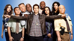 Elenco de Brooklyn 99, com Andy Samberg, Melissa Fumero, Stephanie Beatriz, Terry Crews, Andre Braugher, Joe Lo Truglio, Chelsea Peretti, Joel McKinnon Miller e Dirk Blocker