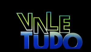 A imagem apresenta fundo preto com a logo da novela "Vale Tudo"